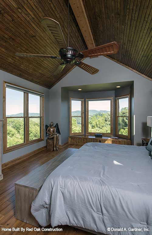 Vaulted ceiling with wood panels in the master bedroom. The Sylvan plan 1321.