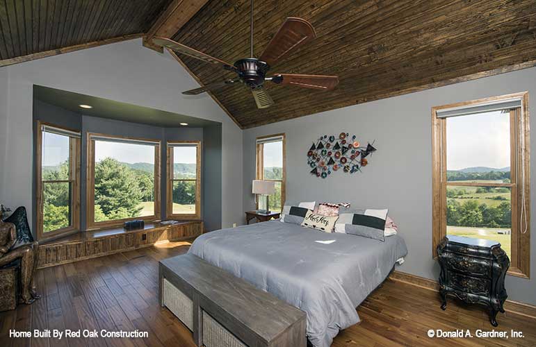 Recessed lighting and bench seating in the master bedroom. The Sylvan plan 1321.