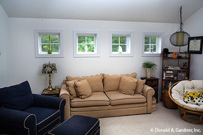 Sitting space and four small windows in the bonus room. The Tamassee plan 333.