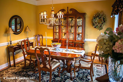 Crown molding along the ceiling and chair rail in the dining room. The Tamassee plan 333.