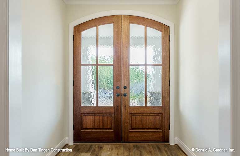 Inviting view of the foyer with double front doors. Tanner plan 1418