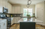 Gorgeous side view of the kitchen island. Tanner plan 1418