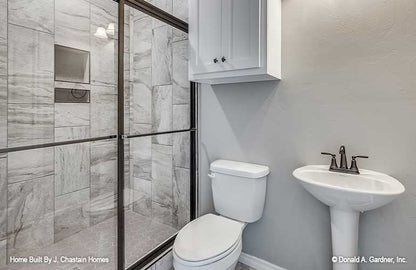 Bathroom with pedestal sink and walk-in shower. Thurman plan 1515