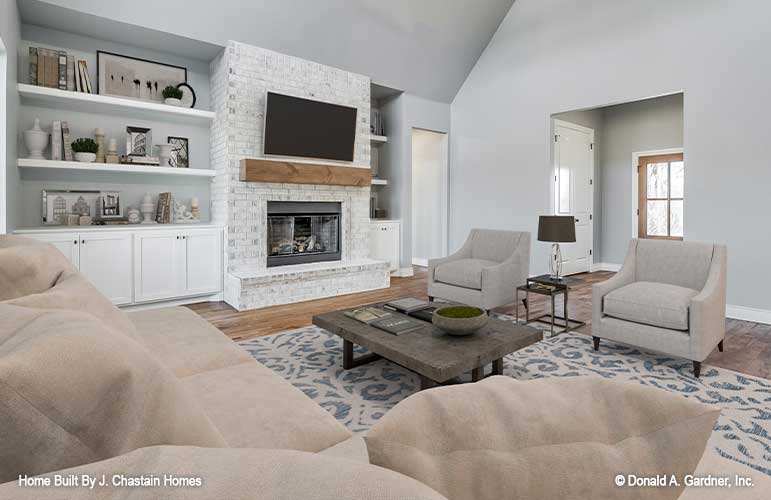 Great room view of the fireplace and built in shelves and cabinets. Thurman plan 1515