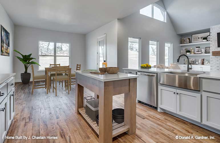 Kitchen view into the dining room and vaulted ceilings of the great room. Thurman plan 1515