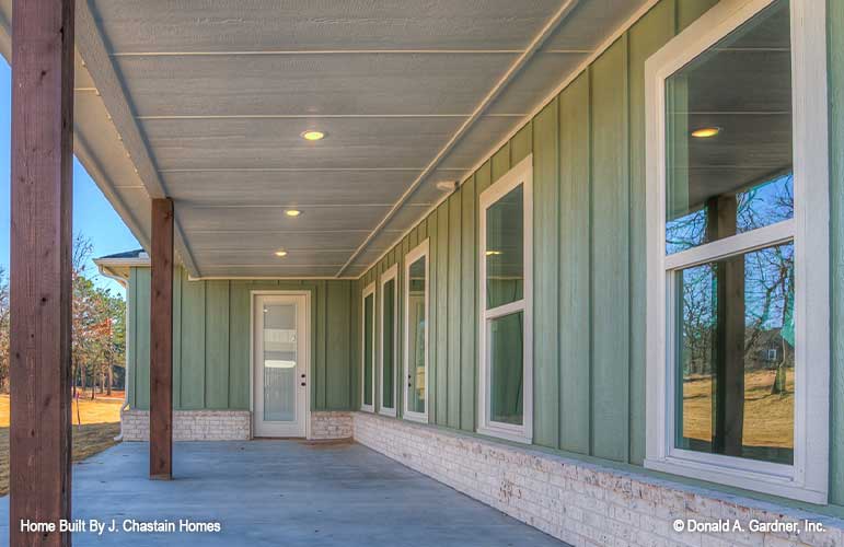 Covered patio with several windows into the home. Thurman plan 1515