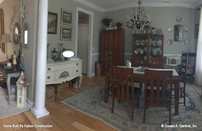 Crown molding along the ceiling and chandelier in the dining room. The Topeka plan 1000.