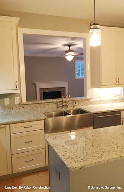 White cabinets in the kitchen. The Topeka plan 1000.