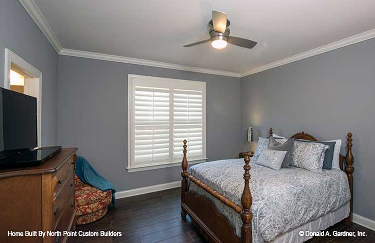 Crown molding along the ceiling and window in the secondary bedroom. The Travis plan 1350.