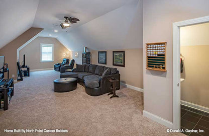 Recessed lighting and ceiling fan in the bonus room. The Travis plan 1350.