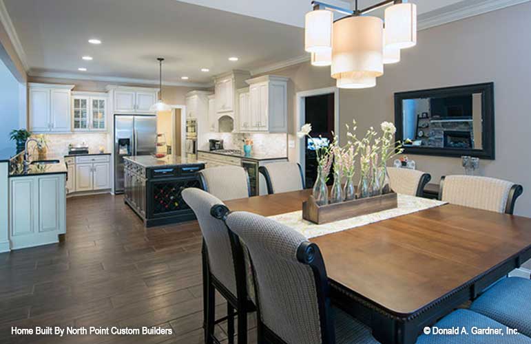 Chandelier in the dining room and full view of the kitchen. The Travis plan 1350.