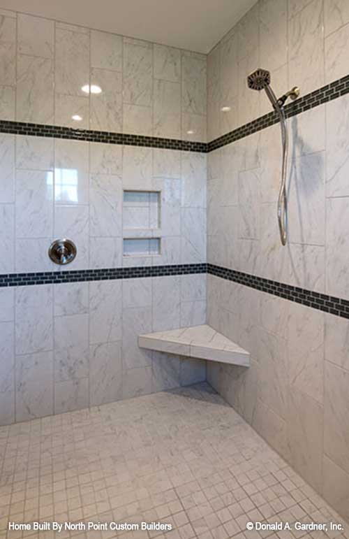 Tiled walk-in shower in the master bathroom. The Travis plan 1350.