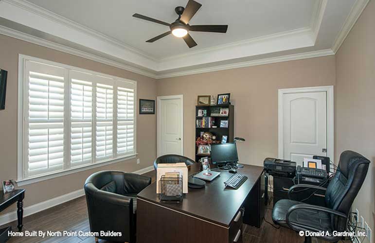 Tray ceiling and large windows in the study. The Travis plan 1350.