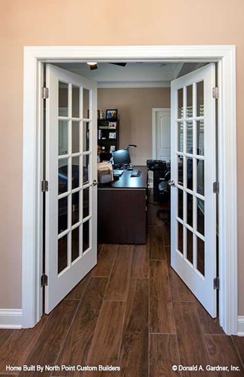 Glass French doors leading to the study. The Travis plan 1350.