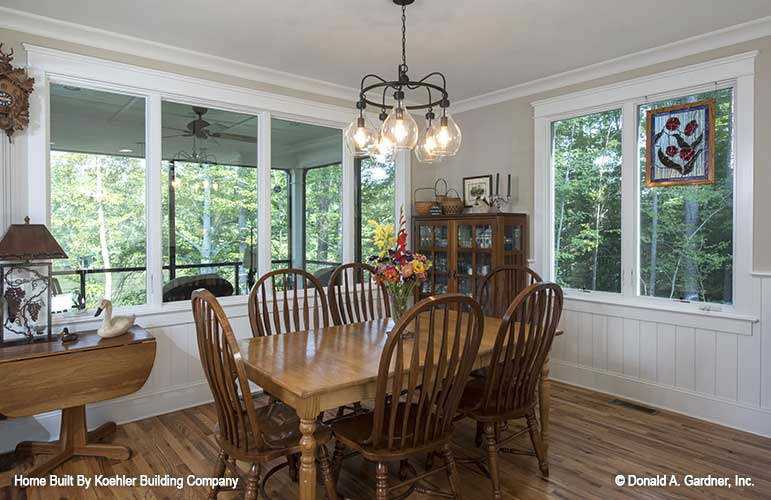 Lots of windows and chandelier in the dining room. The Tristan plan 1311.