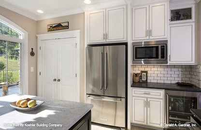 Stainless-steel appliances in the kitchen. The Tristan plan 1311.