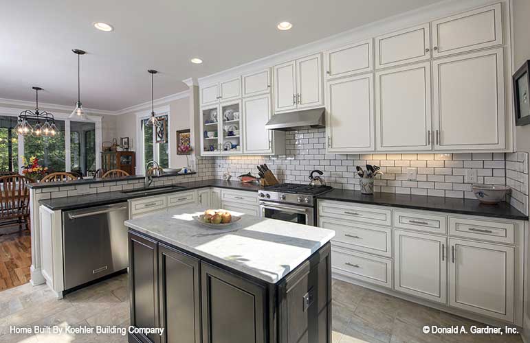 Subway tile and small island in the kitchen. The Tristan plan 1311.