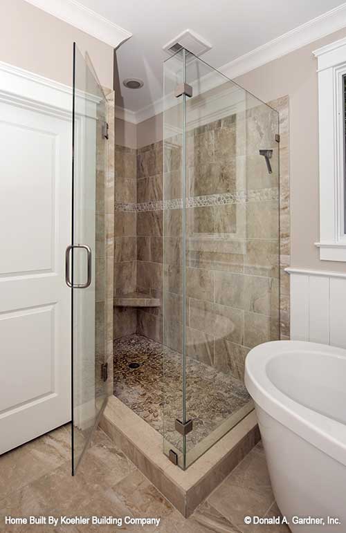 Tiled walk-in shower in the master bathroom. The Tristan plan 1311.