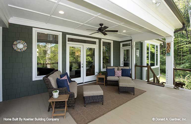 Recessed lighting and ceiling fan on the covered rear porch. The Tristan plan 1311.