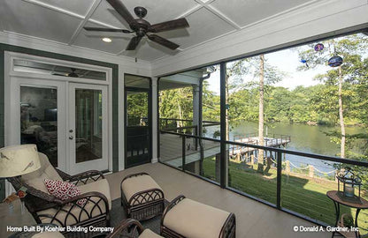 Screened in porch view to the pier and water. The Tristan plan 1311.