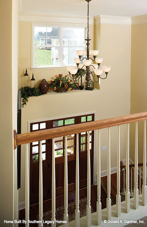 Balcony banister view down to the foyer. The Trotterville plan 984.