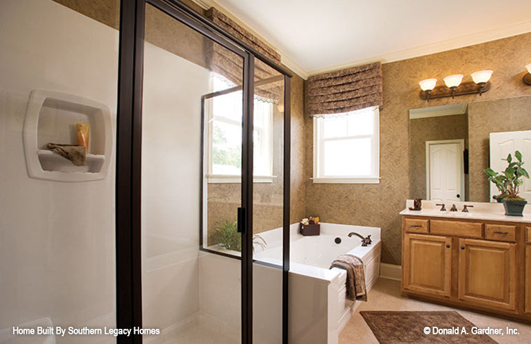 Walk-in shower and soaking tub in the master bathroom. The Trotterville plan 984.