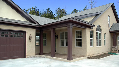 Side view photograph with garage. The Urbandale plan 1068.