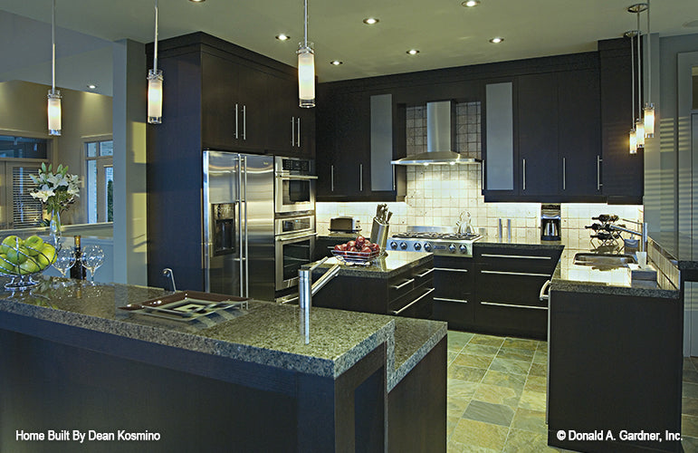 This picture shows the kitchen and island of walkout basement house plan 746 The Vandenberg