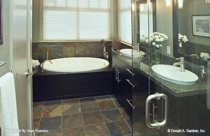 This picture shows the master bathroom and tub of walkout basement house plan 746 The Vandenberg