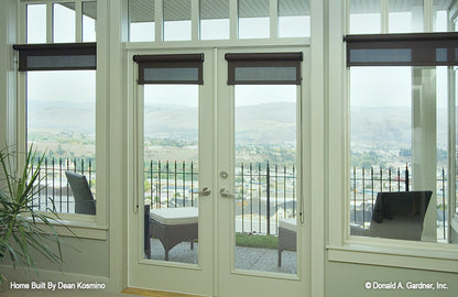 This is a window view picture from bedroom of walkout basement house plan 746 The Vandenberg