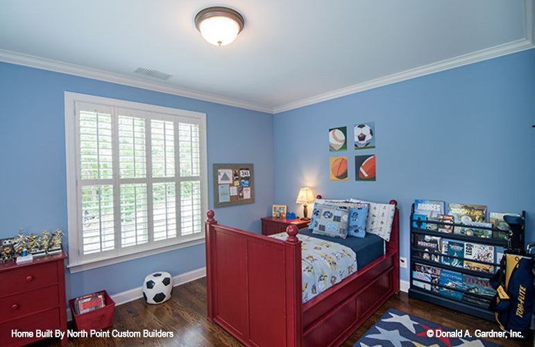 Secondary bedroom for a kid in sports theme. The Weatherford plan 1053.