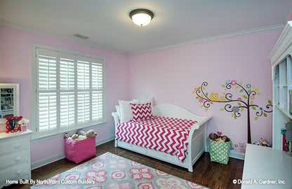 Pretty in pink kids room with flat ceiling. The Weatherford plan 1053.