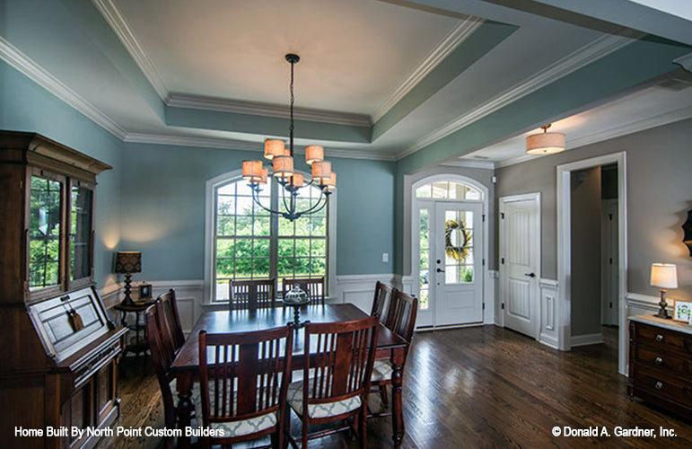 Tray ceiling and chandelier in the dining room. The Weatherford plan 1053.