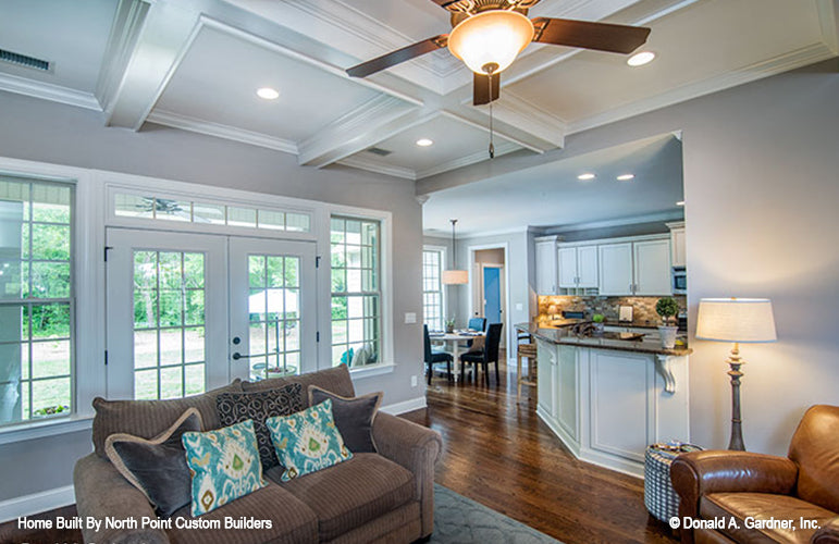 Coffered ceiling and kitchen view from the great room. The Weatherford plan 1053.