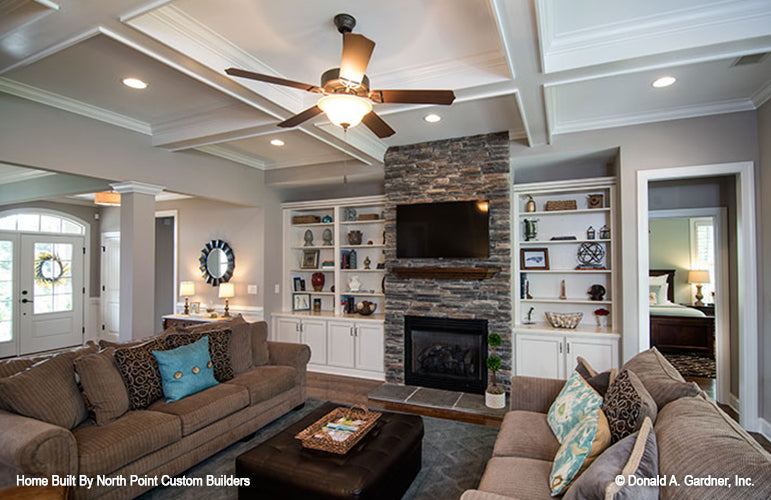 Recessed lighting and view to the foyer in the great room. The Weatherford plan 1053.