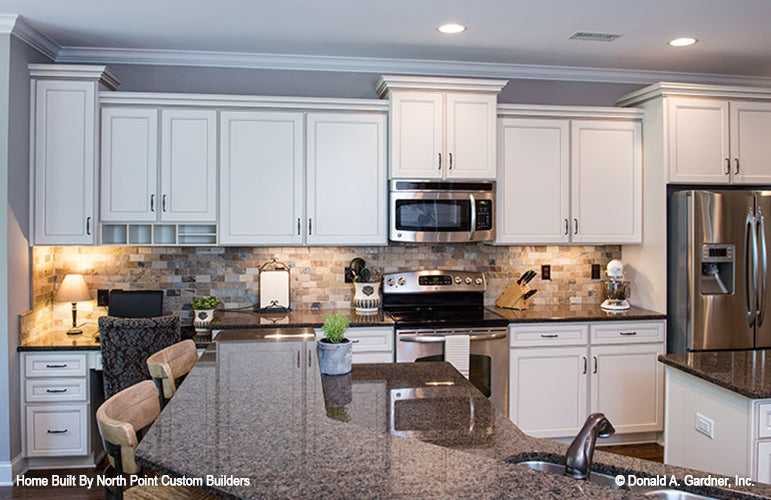 Bar seating in the kitchen. The Weatherford plan 1053.