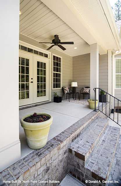 Covered front porch with ceiling fan. The Weatherford plan 1053.