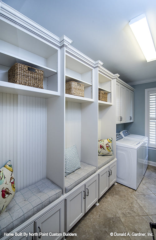 Storage cabinet and benches in the utility room. The Weatherford plan 1053.