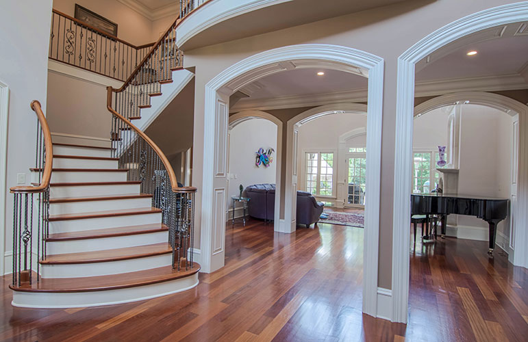 Arch ways and staircase in the foyer. The Wedgewood plan 806.