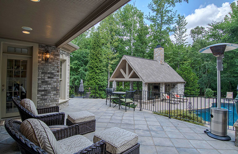 Rear porch view to the pool and pool house. The Wedgewood plan 806.