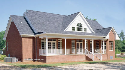 This is a photograph of the rear of traditional house plan 522 The Wentworth as built by a customer