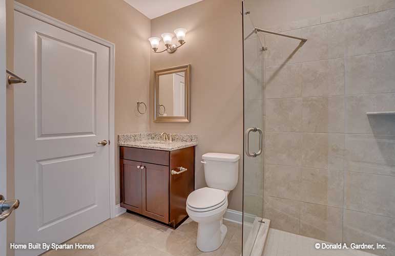 Single sink vanity and walk-in shower in the bathroom. The Westlake plan 1332.