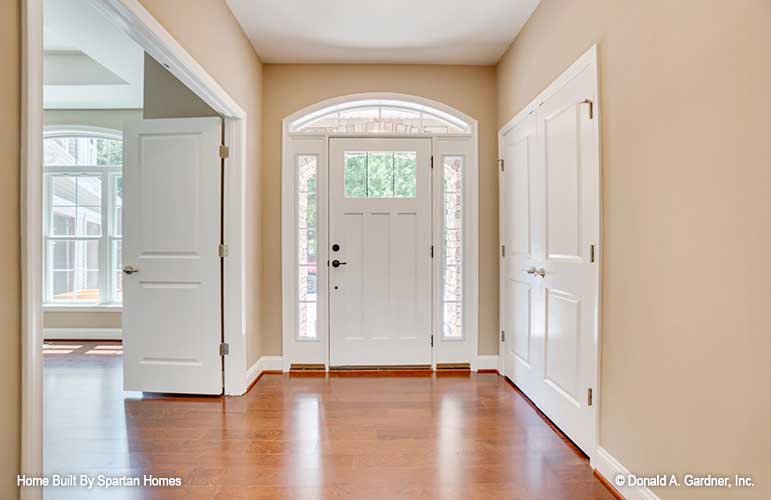 Arched window above entry door in the foyer. The Westlake plan 1332.