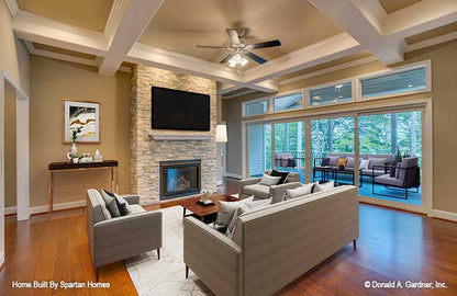 Floor to ceiling stone fireplace in the great room. The Westlake plan 1332.