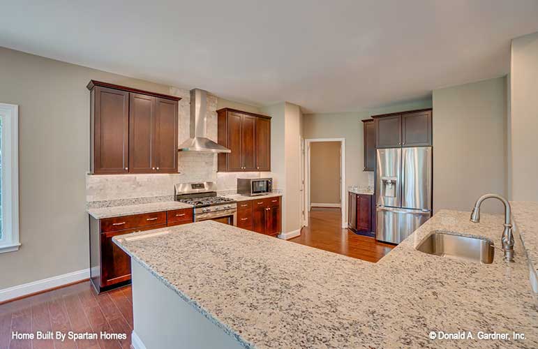 Full view of the kitchen with stainless-steel appliances. The Westlake plan 1332.