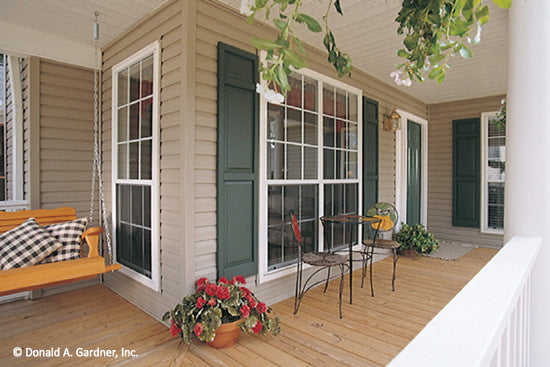 Porch swing on the front porch. The Westport plan 389.