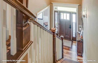 Down the stairs view to the foyer. The Wexler plan 1248.