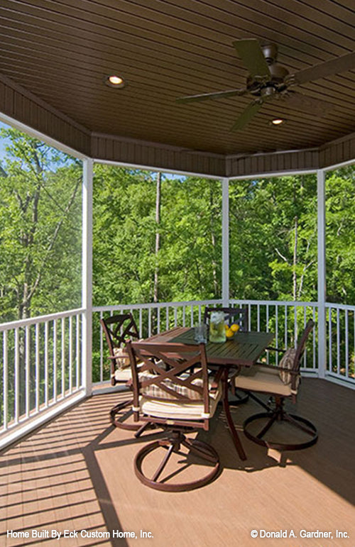 Stained wood panels and recessed lighting in the screened in porch.  The Whitcomb plan 1218.