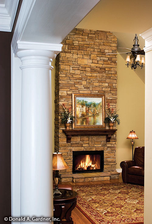 This is a photo of the fireplace in great room of one story house plan 926 The Whiteheart as built by a customer