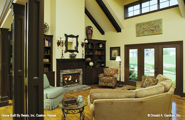 Fireplace and built in shelves in the great room. The Wicklow plan 950.